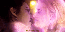 a couple of women kissing with the words " it 's more than okay " written on the bottom