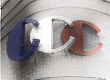 a black and white photo of a cc logo on a building .