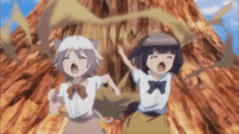 a couple of anime girls are standing next to each other in front of a volcano .