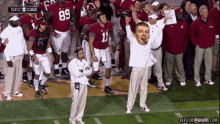 a group of football players including number 11 and number 89 are standing on the field