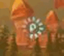 a blurry picture of a clock tower with a clock on top of it .