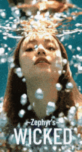 a poster for zephyr 's wicked showing a woman underwater
