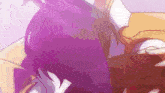 a close up of a person 's hair with purple highlights
