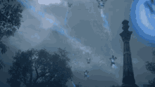 a statue in a cemetery with a blue light coming from it
