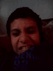 a close up of a person 's face with their mouth open