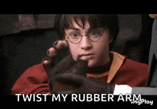 harry potter is wearing a black glove with the words twist my rubber arm below him
