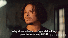 a poster for ironheart shows a man with curly hair looking up