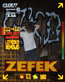a man stands in front of a sign that says zefek