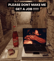 a bottle of sprite sits next to a laptop on a table