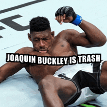 joaquin buckley is trash written over a fighter laying on the ground