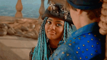 a man and a woman are looking at each other .