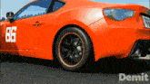 a red sports car with the number 86 on it