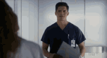 a man in a scrub top has a name tag that says ctv on it