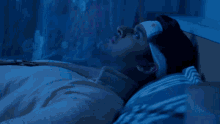 a man with a bandage on his forehead is laying in bed