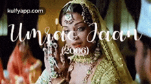 a woman in a veil is talking on a cell phone in a movie poster .