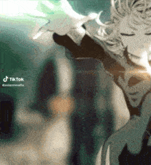 a blurred image of a person with a tiktok logo on the bottom right