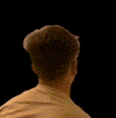 a close up of a person 's face with a surprised look on his face
