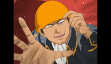 a man wearing a yellow hard hat making a funny face