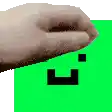 a close up of a hand on a green background with a smiley face .