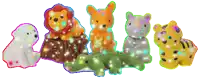 a group of stuffed animals are lined up in a row including a lion