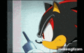 shadow the hedgehog from sonic the hedgehog is talking on a walkie talkie .