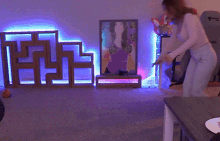 a woman is laying on the floor in a room with a chair that says liveda