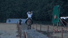 a man is riding a horse with a red bridle