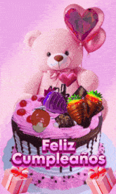 a teddy bear is holding balloons on top of a cake that says " feliz cumpleanos "