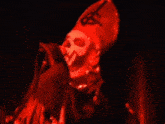 a man wearing a red hat with a dollar sign on it