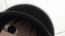 a close up of a person 's face with a black hat