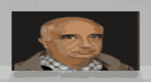 a bald man wearing a plaid shirt and a jacket