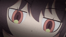 a close up of a girl 's eyes with a yellow circle in the middle of them