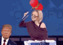 Paula White Hit Donald Trump Head Hammer GIF - Paula White Hit Donald Trump Head Hammer GIFs