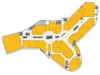 a floor plan of a shopping mall with a circle in the middle of it