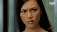 a close up of a woman 's face with astro citra in the corner