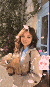 a woman in a trench coat holds a bouquet of flowers in her hands