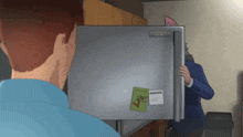 a man is standing in front of a refrigerator with a note on it that says " i 'm sorry "