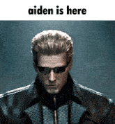 a picture of a man wearing sunglasses with the words aiden is here above him
