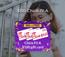 a woman is holding a chick-fil-a gift card in her hand