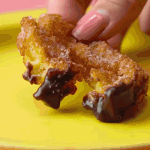 a close up of a yellow plate with a piece of food on it