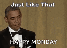 barack obama is giving a speech at a podium while waving his hand .