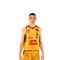 a man wearing a yellow jersey with a red sticker that says strefa