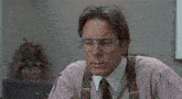 a man wearing glasses and a pink shirt says " i 'm gonna have to go ahead and sorta "