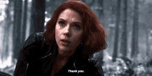 a close up of a woman with red hair saying thank you .
