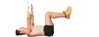 a shirtless man is laying on his back with his legs up