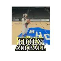 a man holding a basketball on a basketball court with the words holy air ball above him