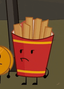 a red bucket of french fries with a sad face on it .