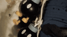 a person is holding a bunch of mickey mouse bottles in a bathtub .