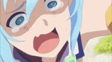 a girl with blue hair is making a funny face with her mouth open