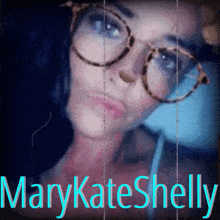 a woman with glasses and the name marykate shelly